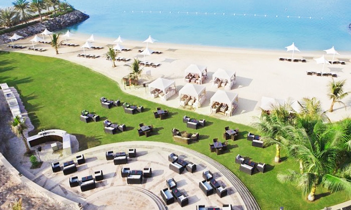 Beach Access with Choice of Beverages for Up to Four at Afyä - Traders Hotel (Up to 70% Off)